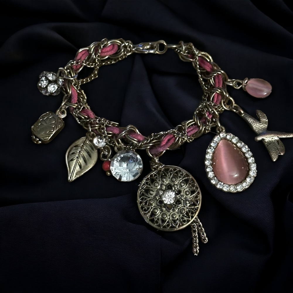 Gold tone woven charm bracelet